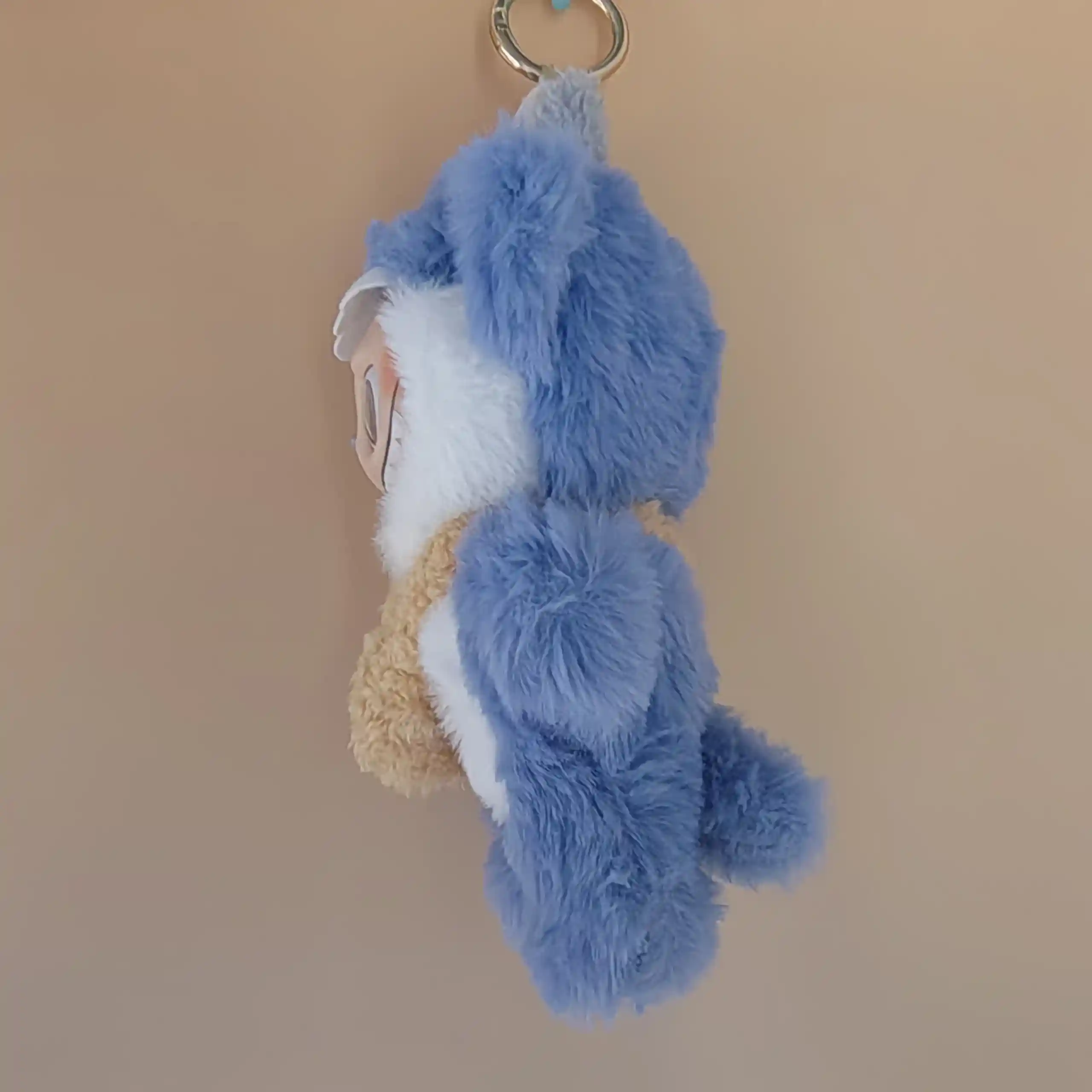 blue monster costume for labubu doll with tan bunny satchel