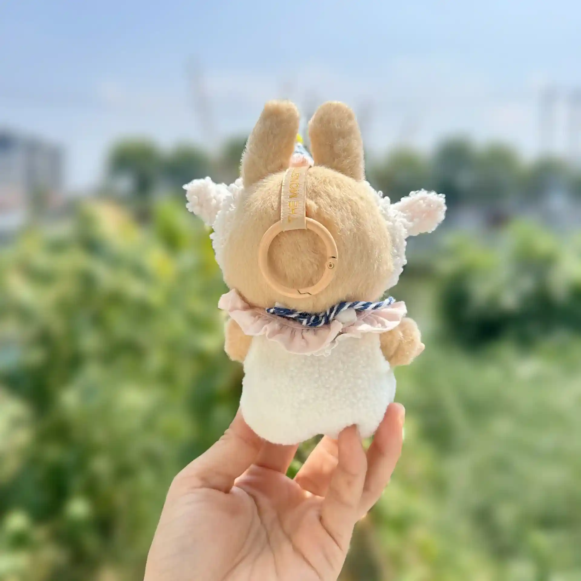 cream colored labubu lamb outfit with party hat accessory