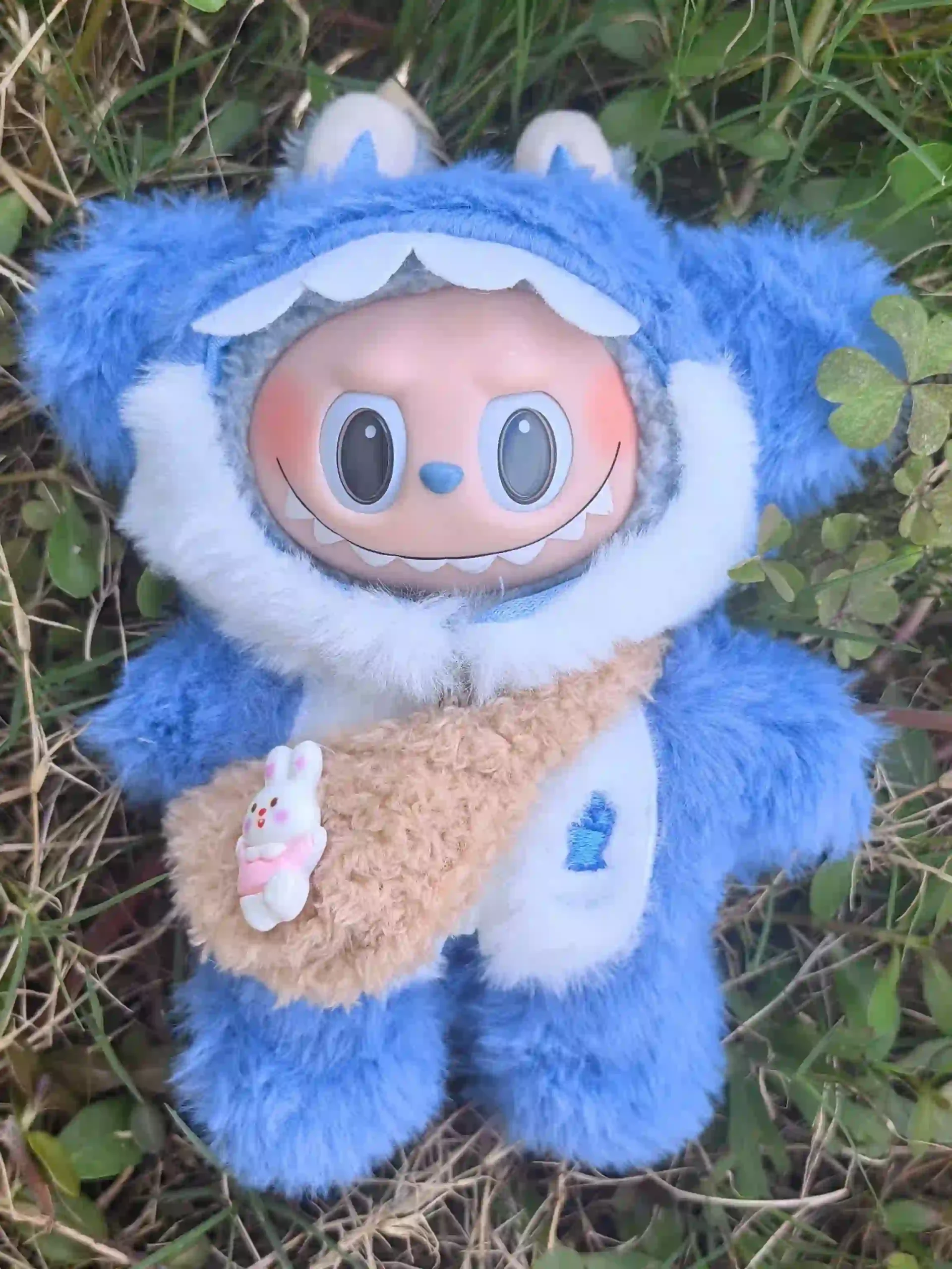 whimsical blue labubu doll outfit with embroidered details scaled